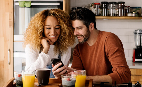 A couple looking at a smartphone