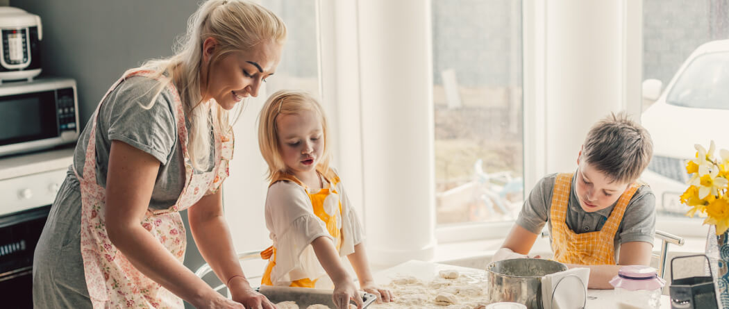 Young family baking in a kitchen